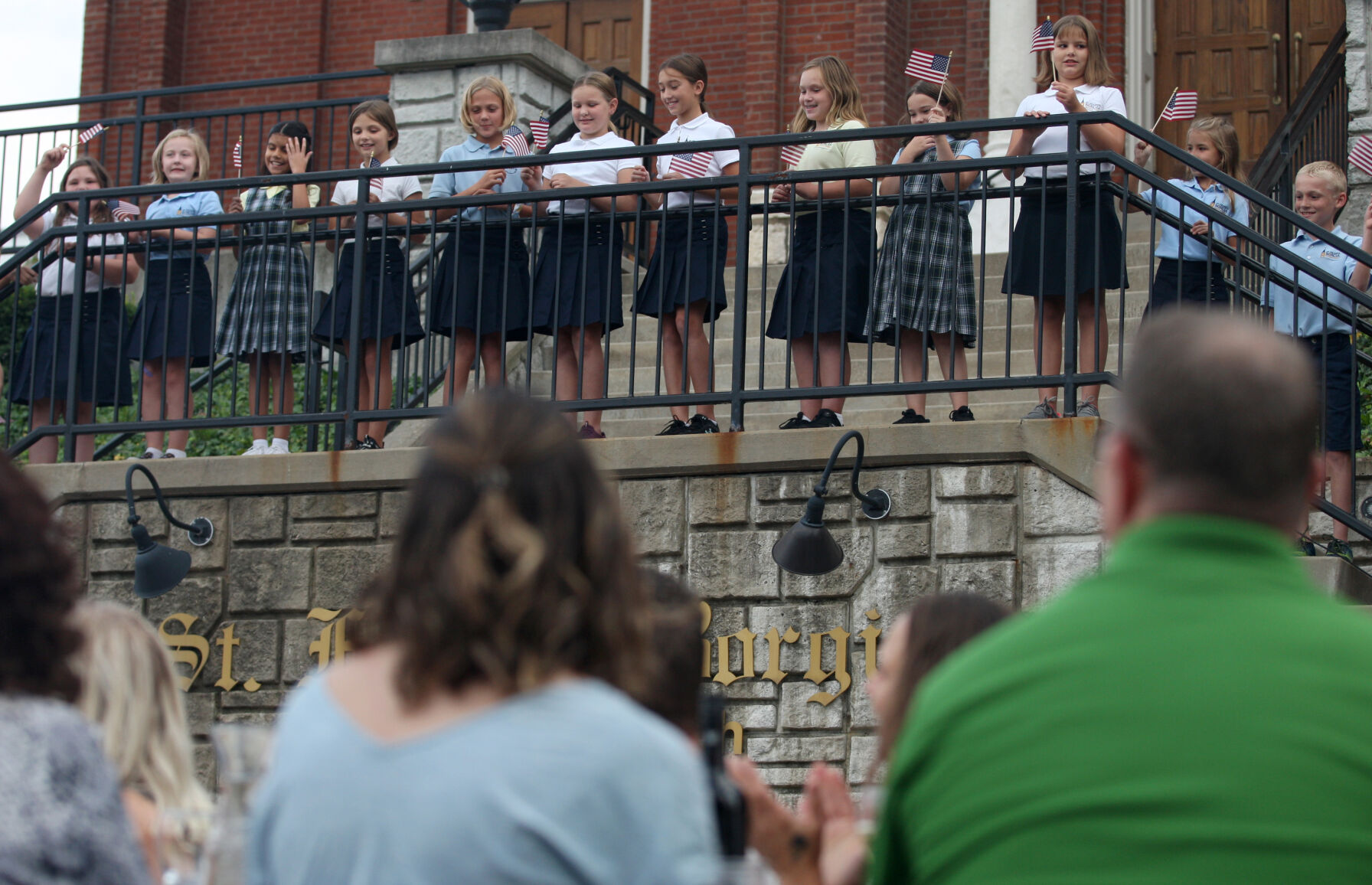 St. Francis Borgia youth choir members sing